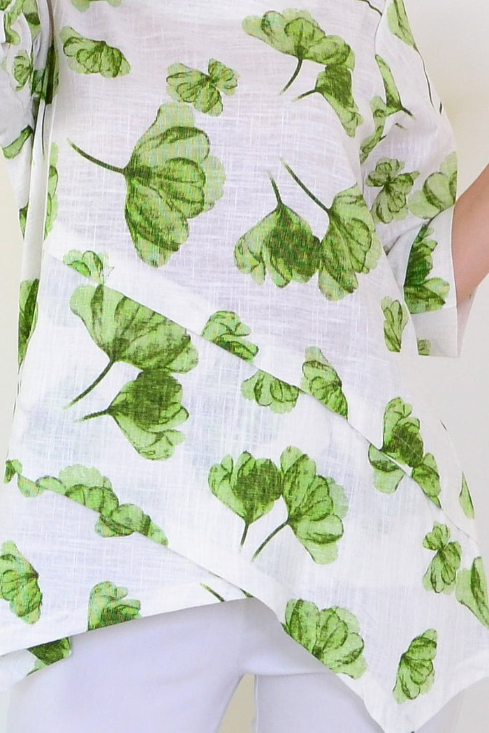 Green flower linen blend tunic top by Ruby Rain, featuring a relaxed fit with floral print and short sleeves.