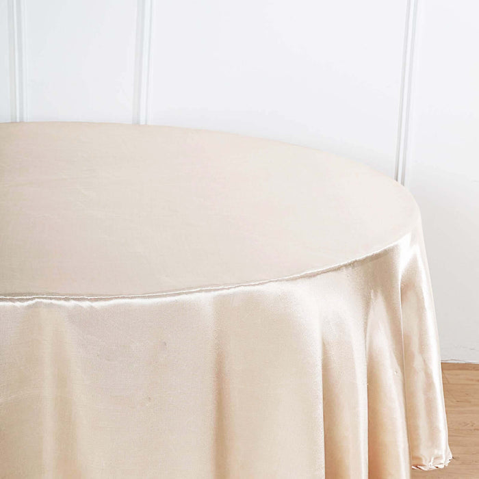 Beige round tablecloth draping elegantly over a table.