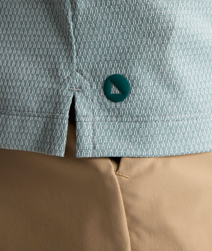 Model is wearing UNTUCKit Textured Performance Polo in green.