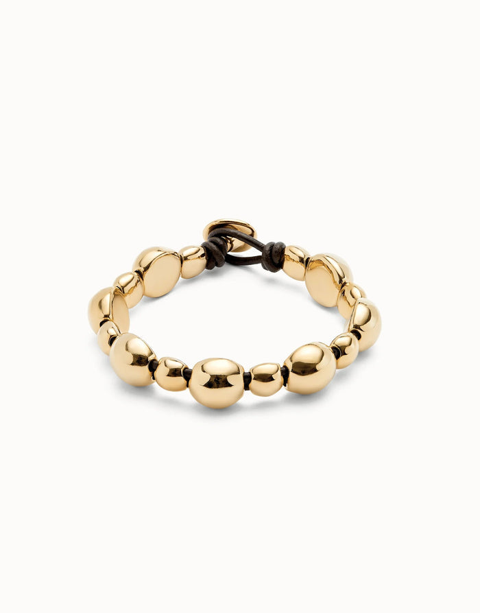 gold beaded bracelet with leather clasp