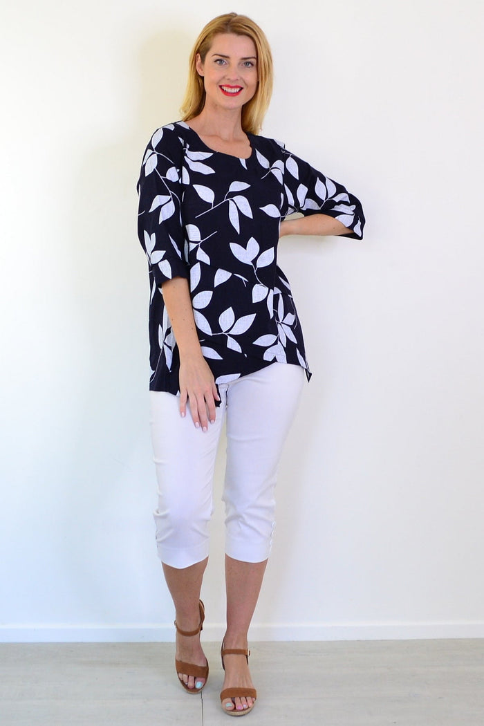 White Petals Linen Blend Tunic Top by Ruby Rain, lightweight and casual with a relaxed fit, displayed on a hanger.