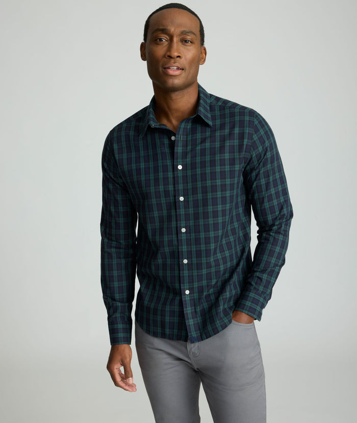 Model is wearing UNTUCKit Wrinkle-Free Grant Shirt in Green & Navy Tartan.
