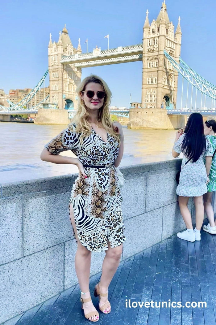 Animal print brown long button-up tunic shirt by Hourglass, featuring a stylish animal pattern and classic button details.