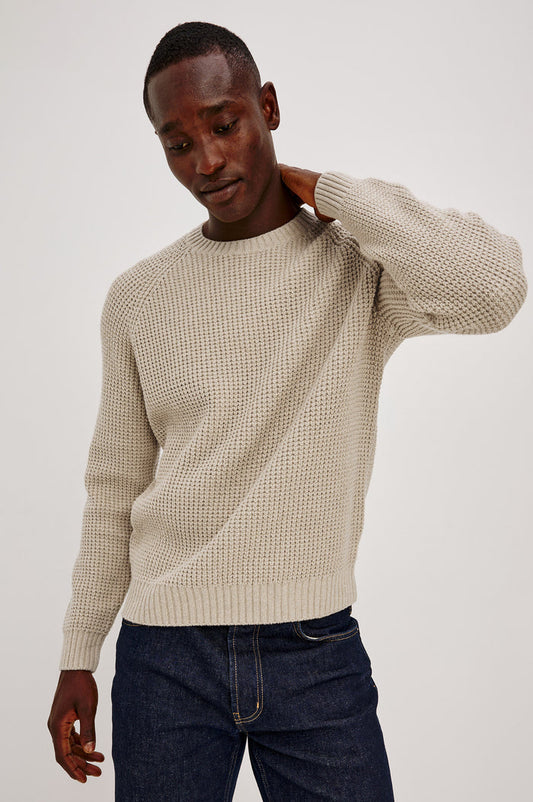 Augustus Sweater in Midweight Cotton-Linen Knit With Thermal Stitch, Textured Bouclé Finish, Raglan Long Sleeves, and Ribbed Trim in Vellum Colorway - Upper Body Front View Featured on Model