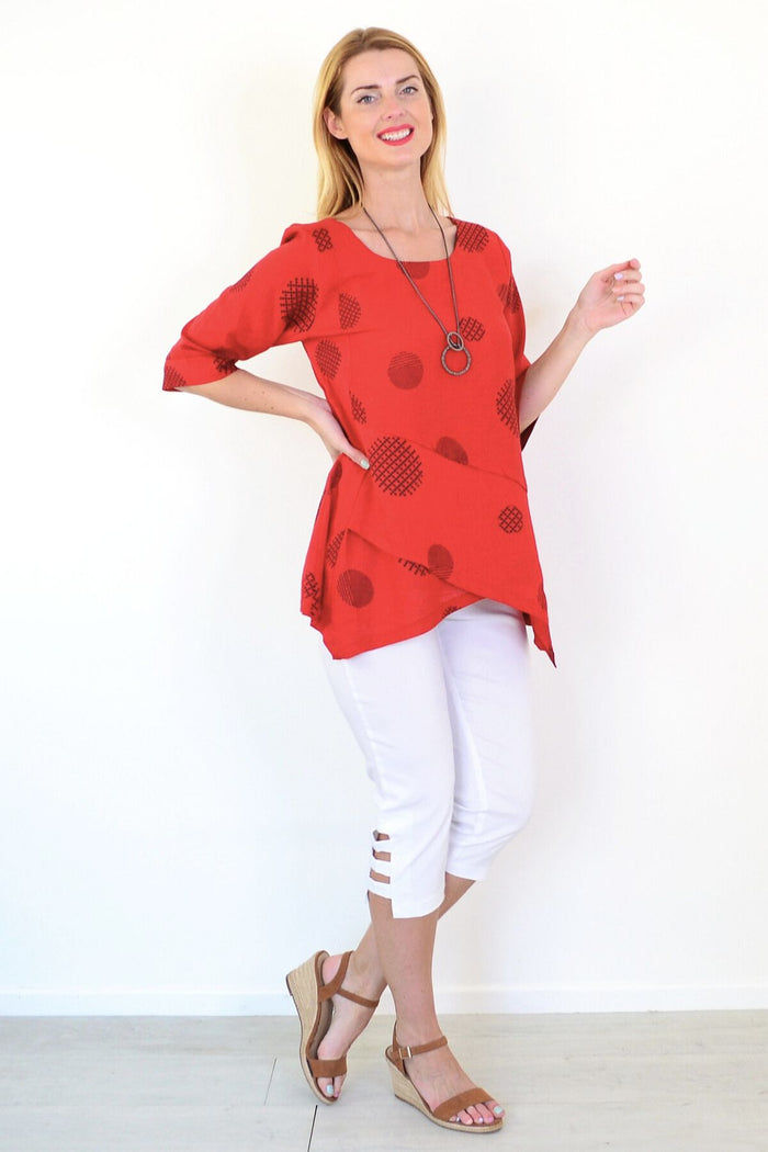 Black circle linen blend tunic top by Ruby Rain, featuring a relaxed fit and stylish round neckline, displayed on a hanger.