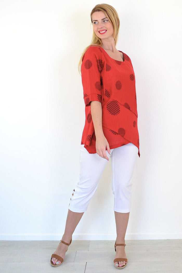 Black circle linen blend tunic top by Ruby Rain, featuring a relaxed fit and stylish round neckline, displayed on a hanger.
