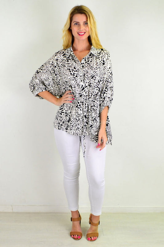Black giraffe print relaxed fit tunic blouse by Hourglass, featuring a loose, comfortable design and stylish animal print pattern.