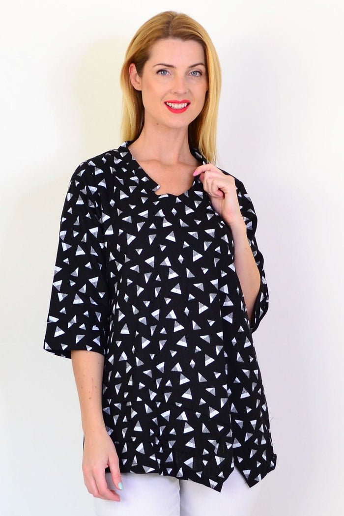 Black and grey triangle-pattern linen blend tunic top by Ruby Rain, shown on a hanger with a relaxed fit.