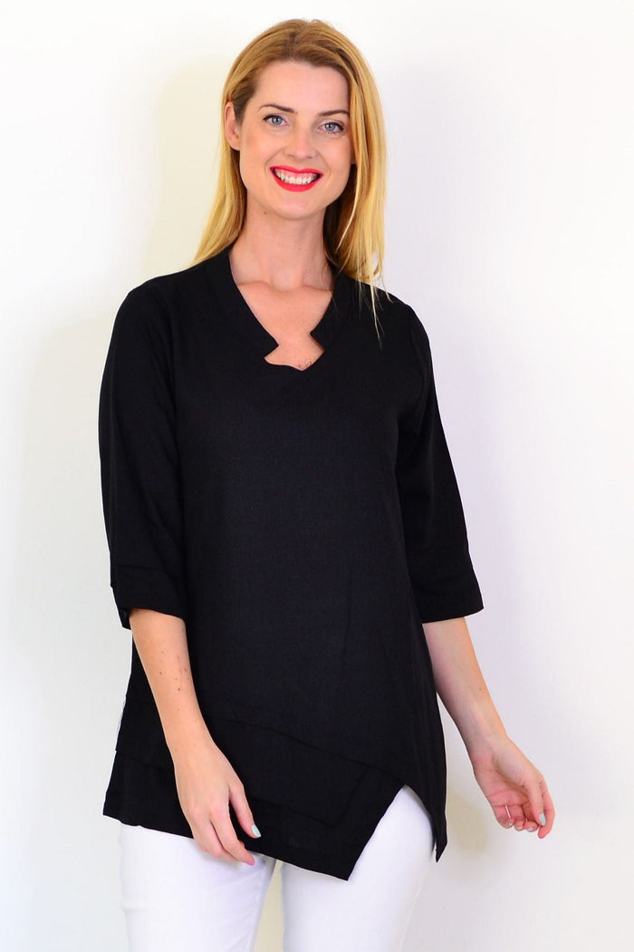 Black linen blend tunic top by Hourglass, featuring a loose fit and casual style, displayed on a hanger against a neutral background.
