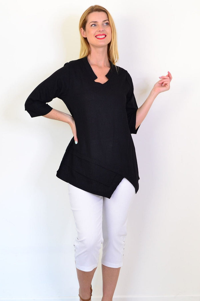 Black linen blend tunic top by Hourglass, featuring a relaxed fit and natural fabric texture, displayed on a neutral background.