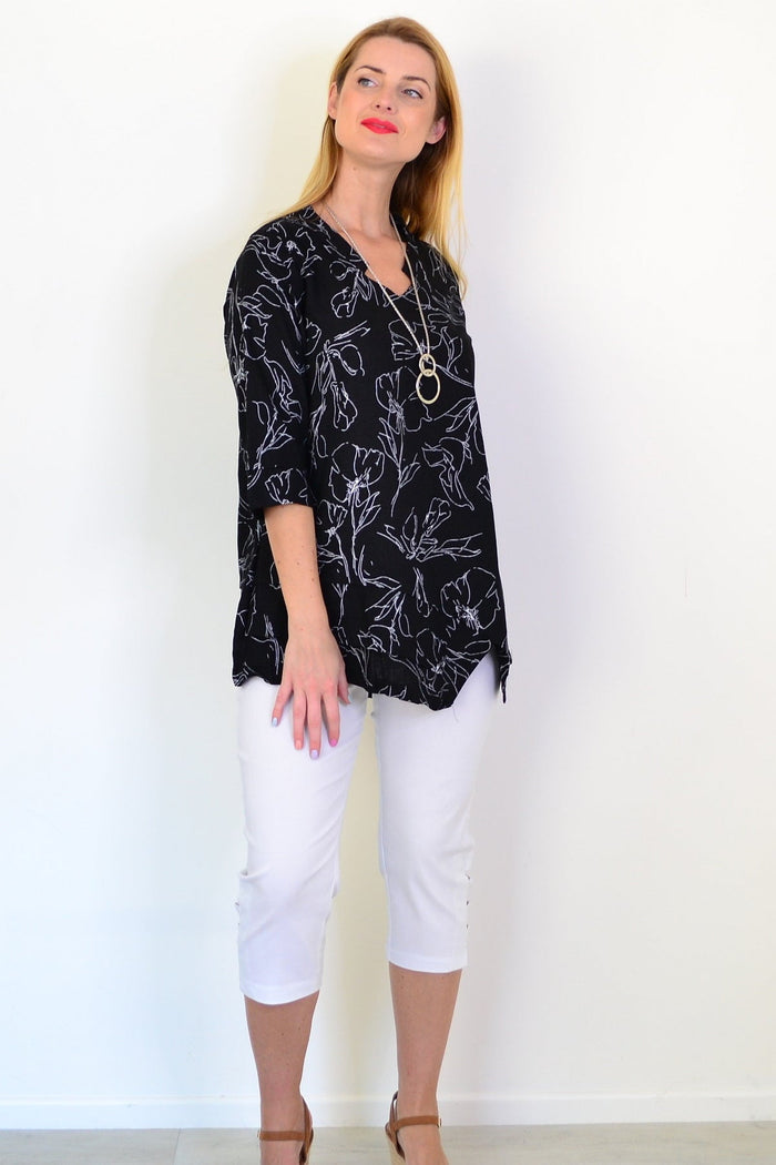 Black and white floral linen blend tunic top by Ruby Rain featuring a relaxed fit and lightweight, breathable fabric.
