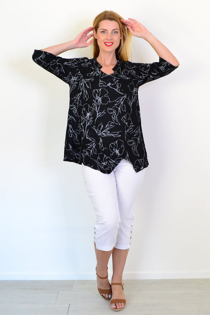 Black and white floral linen blend tunic top by Ruby Rain, featuring a flowing design and intricate floral pattern.