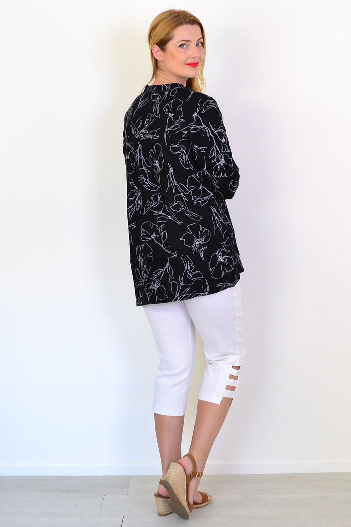 Black and white floral linen blend tunic top by Ruby Rain, featuring a relaxed fit and lightweight fabric.