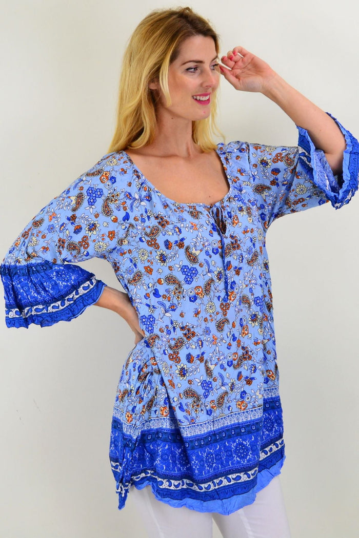 Blue paisley swing crinkle tunic top from Hourglass, featuring a loose fit, flowing fabric, and intricate paisley pattern.