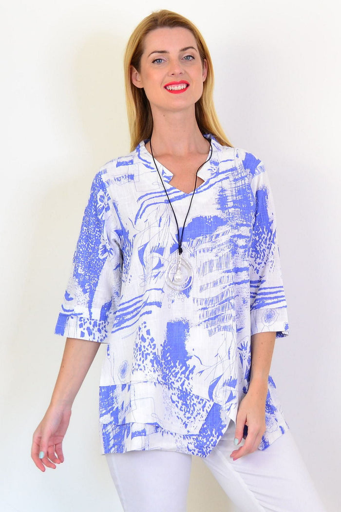 Blue Splash Linen Blend Tunic Top by Hourglass, lightweight and flowy with a relaxed fit and vibrant blue splash pattern.