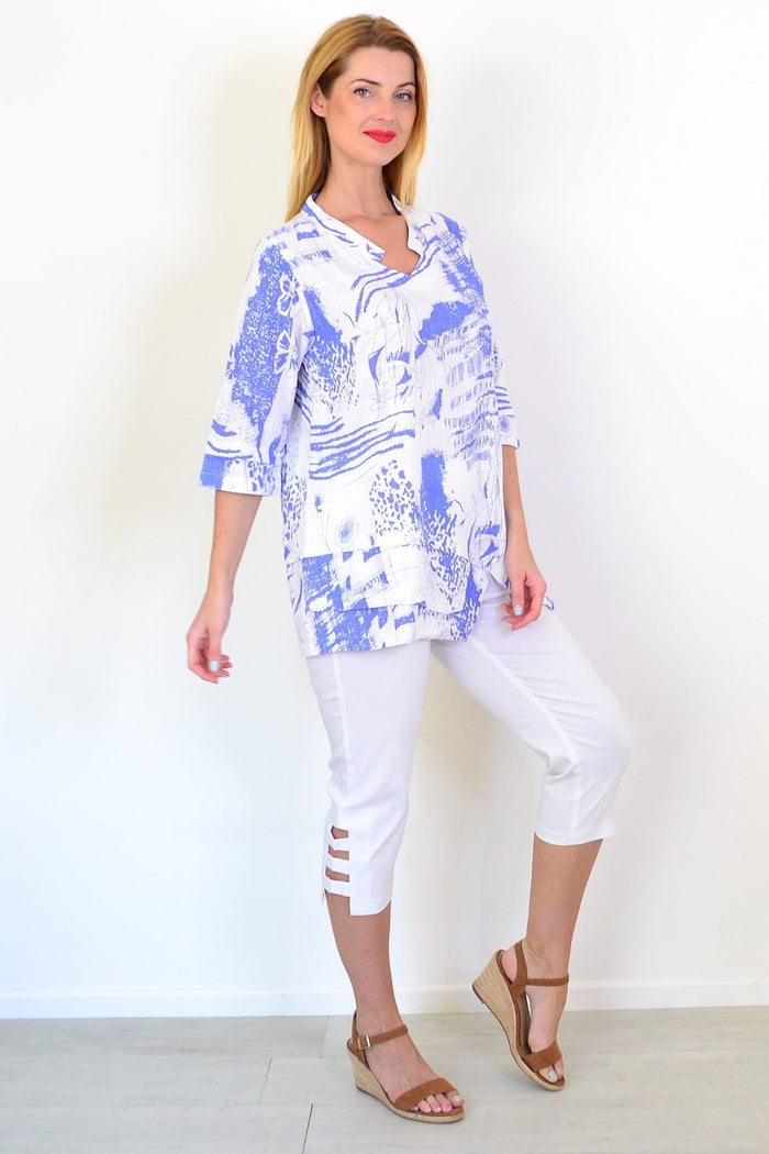 Blue Splash linen blend tunic top by Hourglass, lightweight and relaxed fit with a vibrant blue splash pattern, on a mannequin.