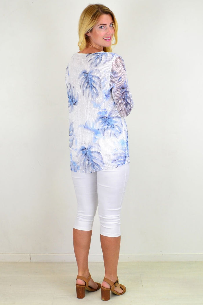 Blue tropical sequin tunic top by Ruby Rain featuring vibrant tropical print and shimmering sequins, sleeveless design, and relaxed fit.