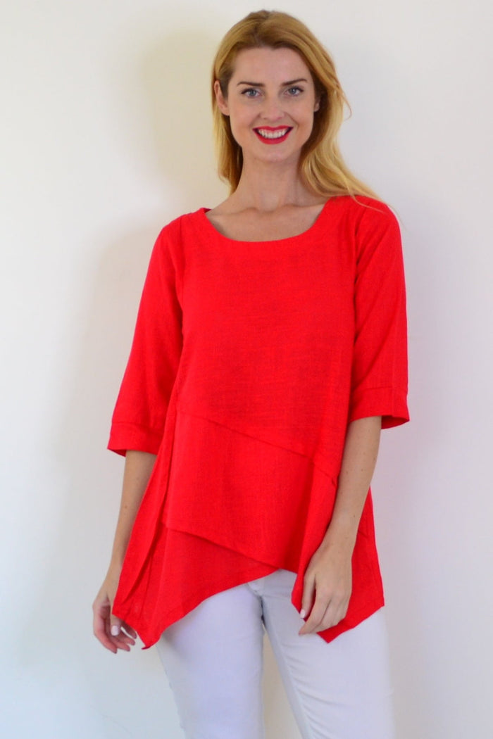 Candy Apple layered linen blend tunic top by Ruby Rain, featuring a relaxed fit and stylish design, displayed on a hanger.