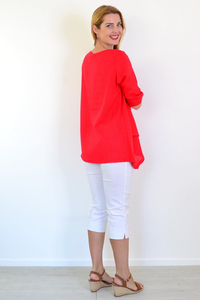 Candy apple colored layered linen blend tunic top by Ruby Rain, featuring a relaxed fit and stylish design.