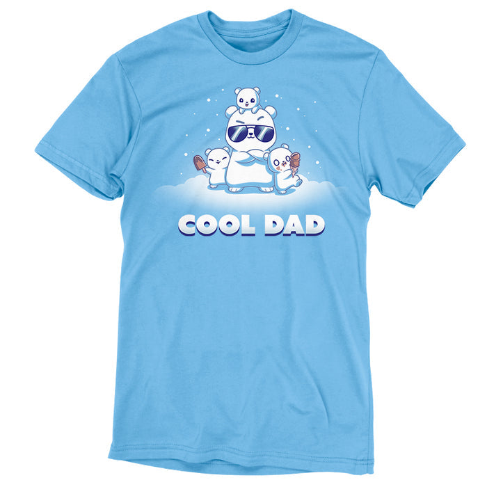 Premium Cotton T-shirt_TeeTurtle light blue Cool Dad (Polar Bear) apparel featuring a dad polar bear with sunglasses and his arms crossed, two of his cubs holding frozen desserts, one cub perched on top of his head with snow falling around them, and the caption, "Cool Dad".