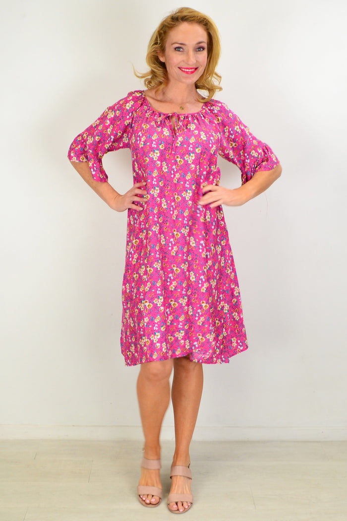Hourglass Cupid's Corner shift tunic dress displayed on a hanger, showcasing its relaxed fit and soft fabric.