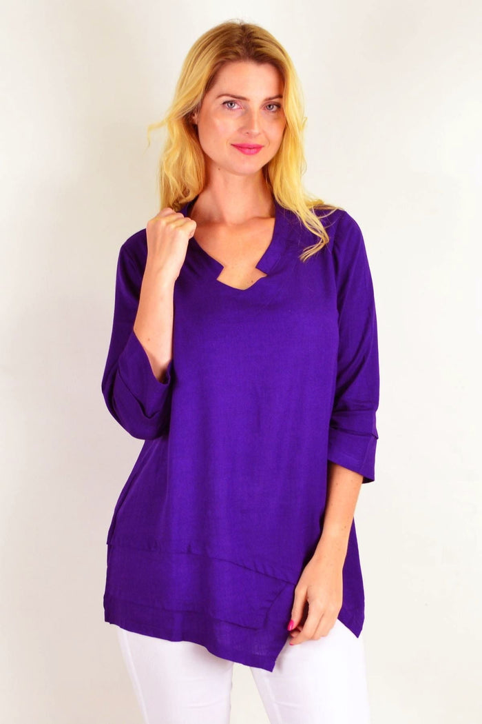 Deep purple linen cotton tunic top by Ruby Rain, featuring a relaxed fit and simple neckline, shown on a model.