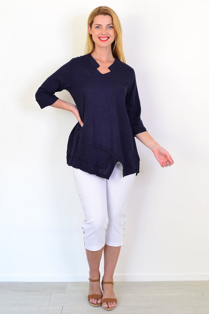 Hourglass denim linen blend tunic top displayed on a hanger with a relaxed fit and casual style.