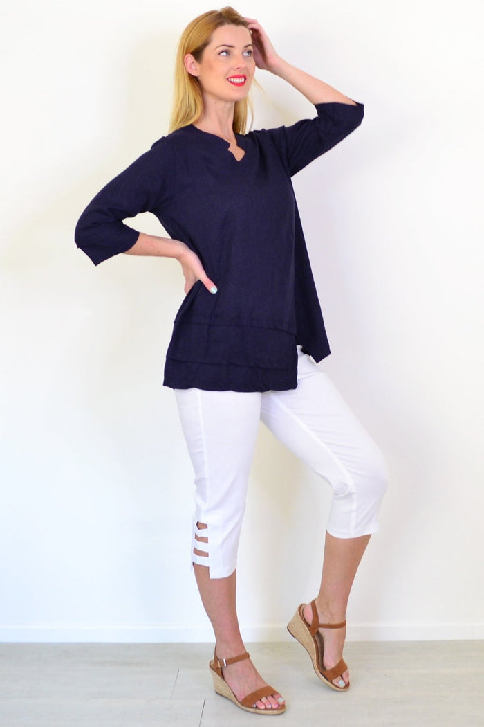 Hourglass denim linen blend tunic top, lightweight and relaxed fit, displayed on a mannequin with side view.