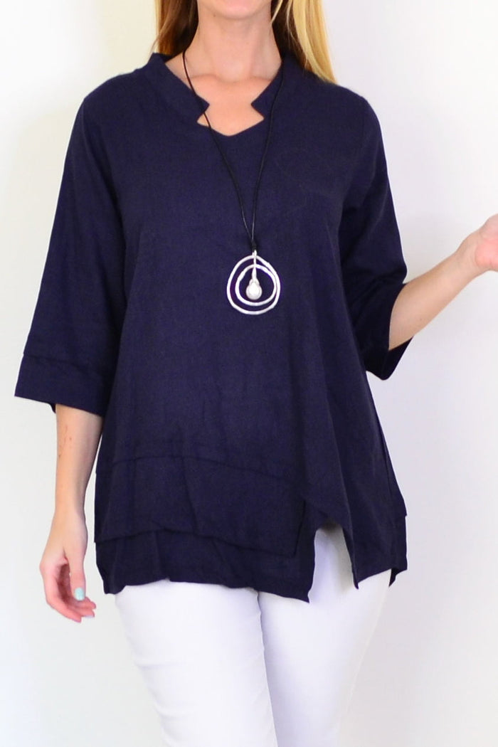 Light blue denim linen blend tunic top by Hourglass displayed on a hanger, showcasing its relaxed fit and casual style.