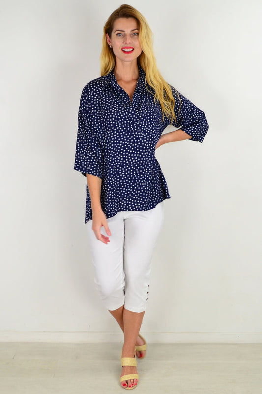 Stylius Dot in a Dot tunic top with a relaxed fit, featuring a playful polka dot pattern and long sleeves.