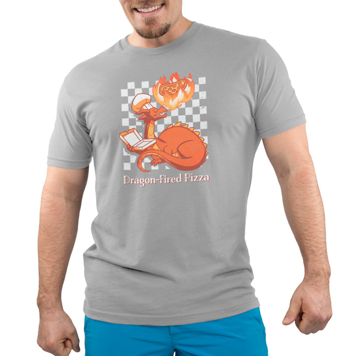 Premium Cotton T-shirt_TeeTurtle Dragon-Fired Pizza silver gray t-shirt featuring a dragon wearing a chef's hat, breathing extra hot fire onto a pizza while holding an open pizza box. Text at the bottom reads "Dragon-Fired Pizza."