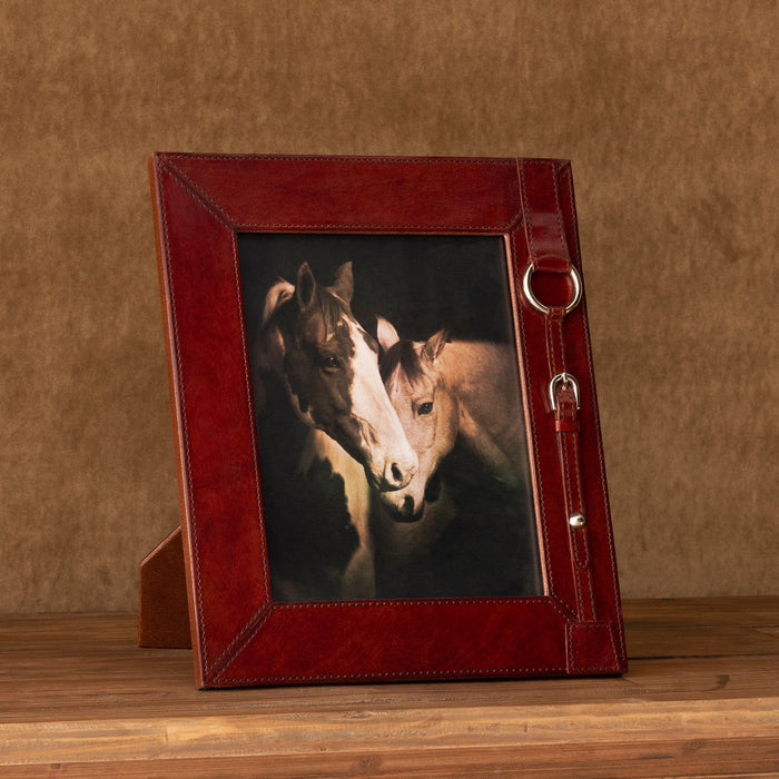 Capture your favorite memories with this stunning Equestrian Strap Leather Photo Frame. Crafted with beautiful burgundy leather and stylish equestrian strap detailing, this 4X6 photo frame will bring sophistication and charm to any room. Enjoy every moment with class and style!