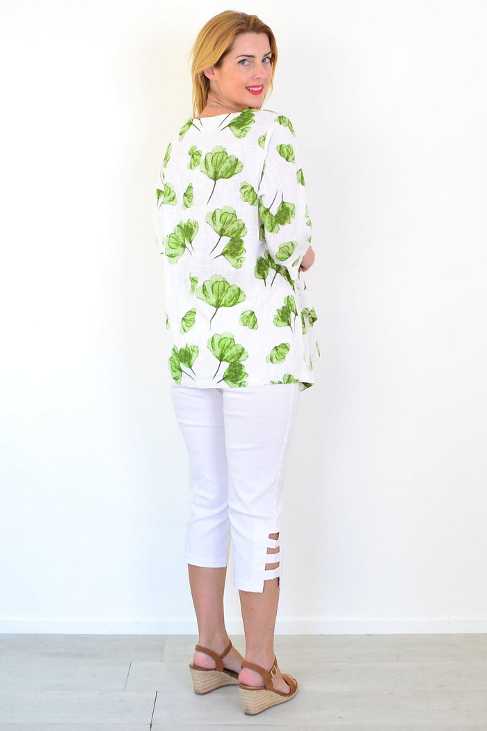 Green flower linen blend tunic top by Ruby Rain, showing a flowy, floral-patterned design with a relaxed fit and long sleeves.