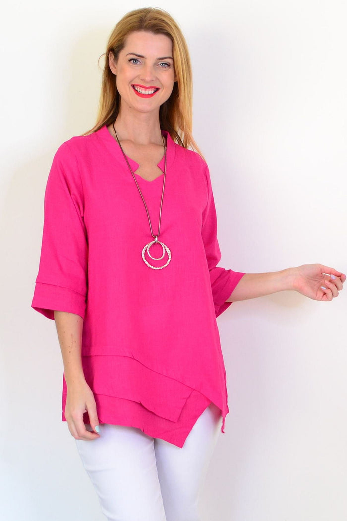 Hot pink linen blend tunic top from Hourglass featuring a relaxed fit and casual style, displayed on a hanger against a neutral background.