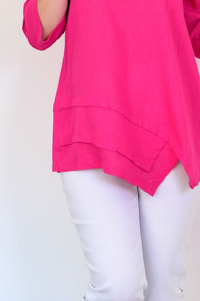 Hot pink linen blend tunic top by Hourglass, featuring a relaxed fit with long sleeves and a rounded neckline.
