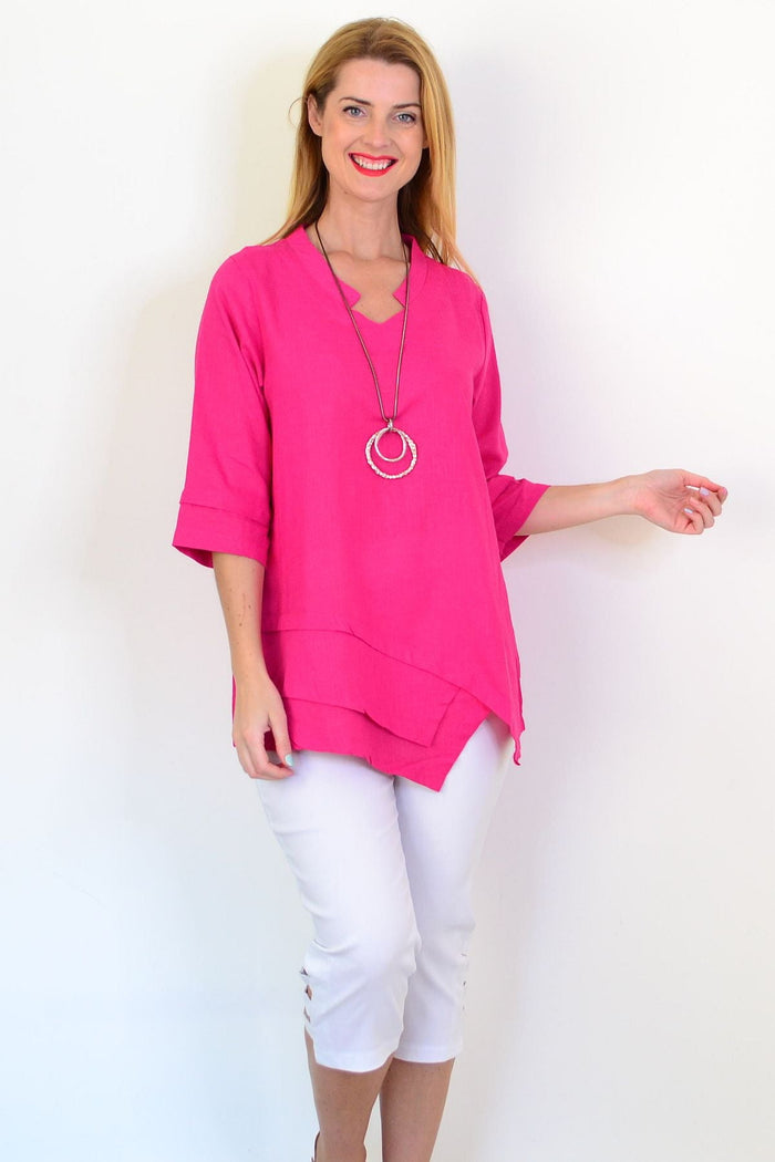 Hot pink linen blend tunic top by Hourglass, featuring a relaxed fit with long sleeves and a casual, stylish design.