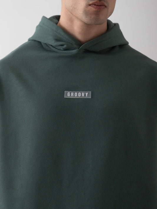Hunter green oversized hoodie detail closeup kangaroo pocket front Pakistan – GROOVY