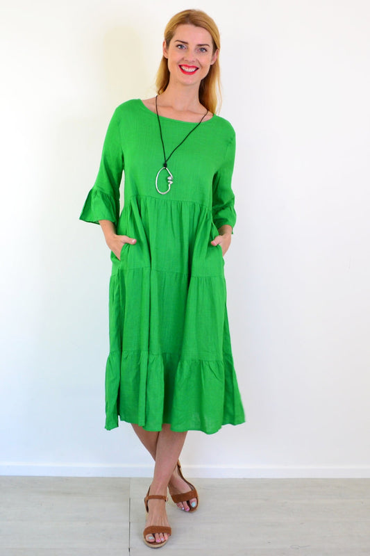 Jade green Hourglass shift tunic dress displayed on a hanger, featuring a relaxed fit and simple, elegant design.