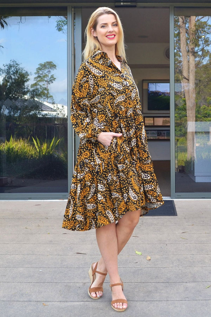 Jasmine Paisley Boho Australia tunic dress with floral pattern, V-neckline, and relaxed fit, displayed on a hanger.