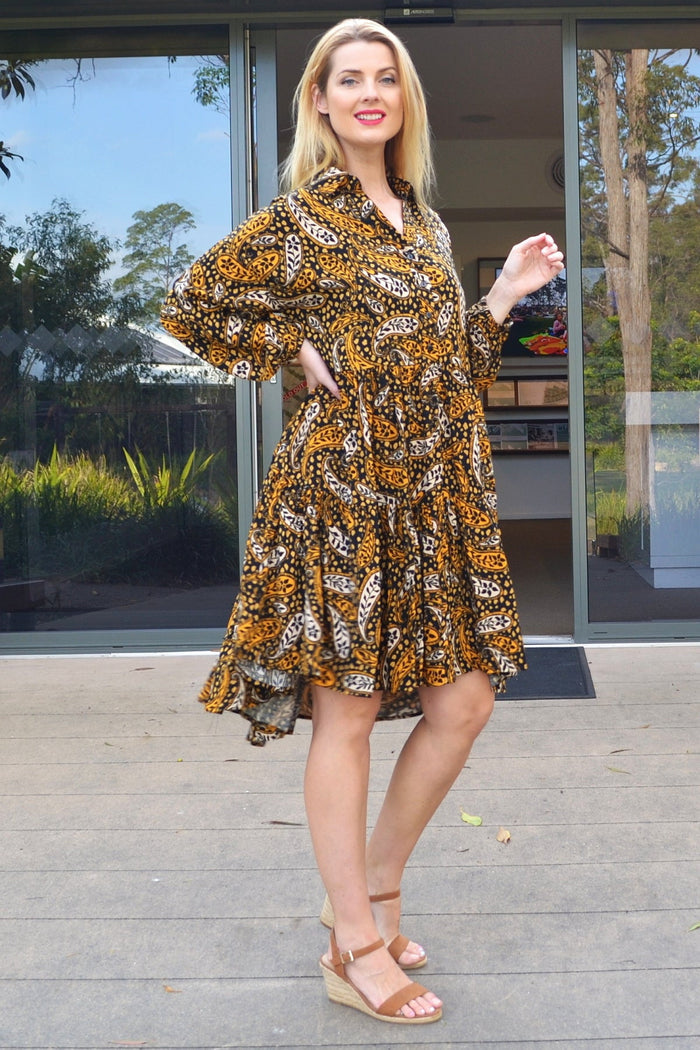 Jasmine Paisley Boho Australia tunic dress displayed on a hanger, featuring intricate paisley patterns and flowing fabric.