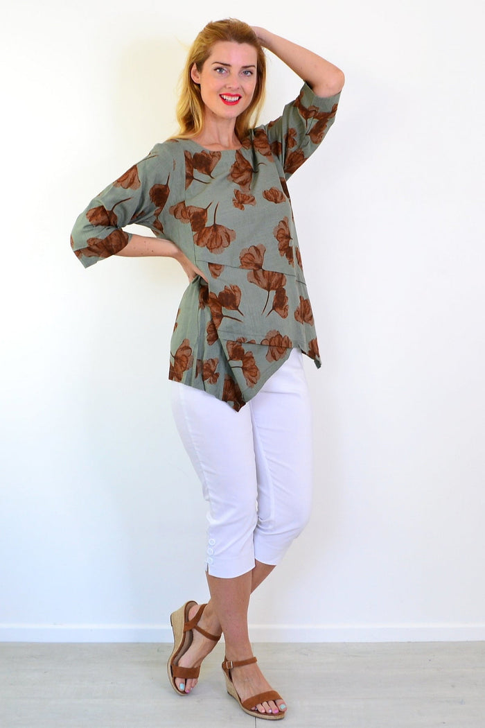 Khaki brown flower linen blend tunic top by Ruby Rain, featuring a relaxed fit and floral pattern, displayed on a hanger.