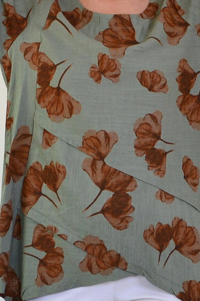 Khaki brown flower linen blend tunic top by Ruby Rain, featuring a relaxed fit and floral pattern, shown on a hanger.