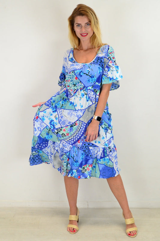 Orientique Kintsugi Tunic Dress hanging on a mannequin with a relaxed fit and intricate patterned fabric.