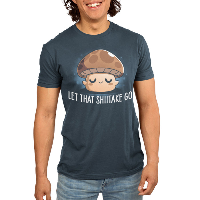 Premium Cotton T-shirt_TeeTurtle denim blue Let That Shiitake Go apparel featuring a brown zen mushroom with its eyes closed and caption reads, "let that shiitake go".