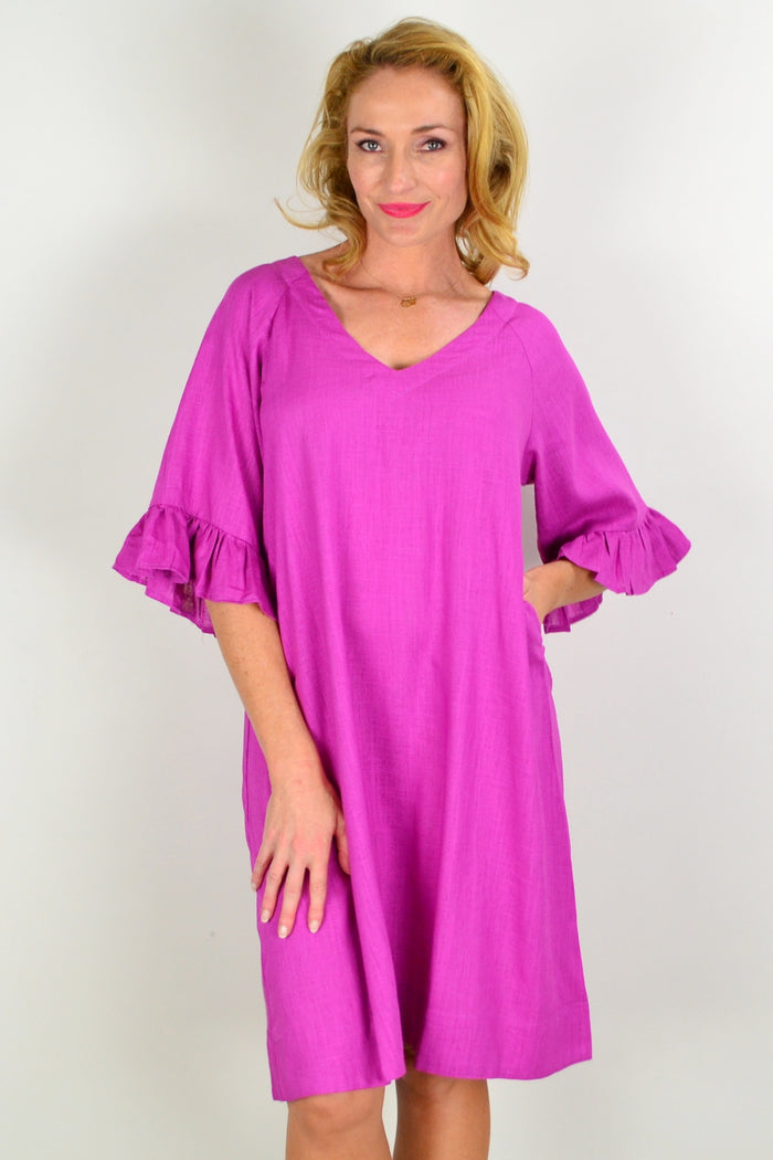 Magenta Hourglass three-shift tunic dress displayed on a hanger, showcasing its vibrant color and relaxed fit.