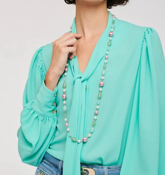 Weill Paris multicolor pearl bead long necklace in pastel mint and blush tones styled with an aqua bow blouse and denim jeans