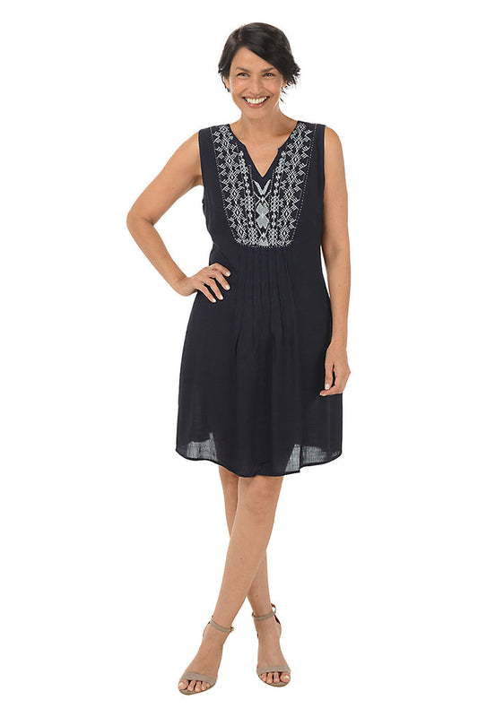 Woman wearing a sleeveless navy dress