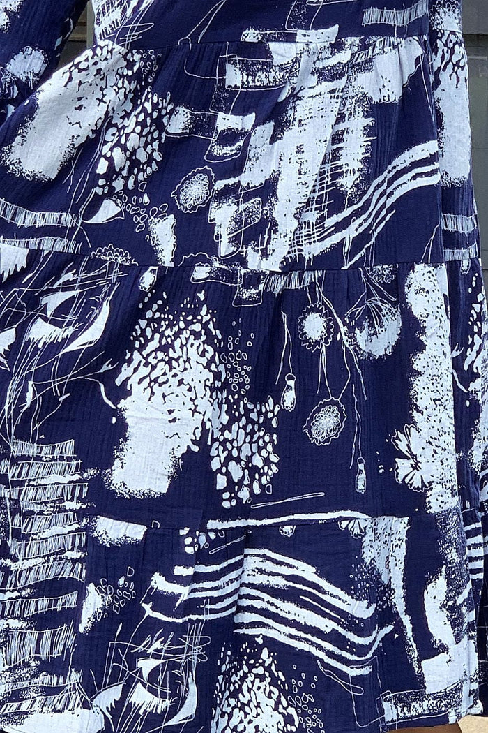 Navy and white abstract print tunic dress by Hourglass, featuring a relaxed fit and stylish design, shown on a model.