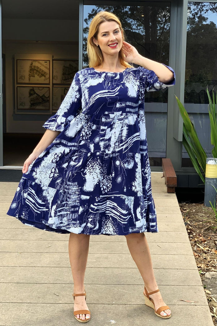 Navy and white abstract print tunic dress by Hourglass, featuring a relaxed fit and stylish design, shown on a mannequin.