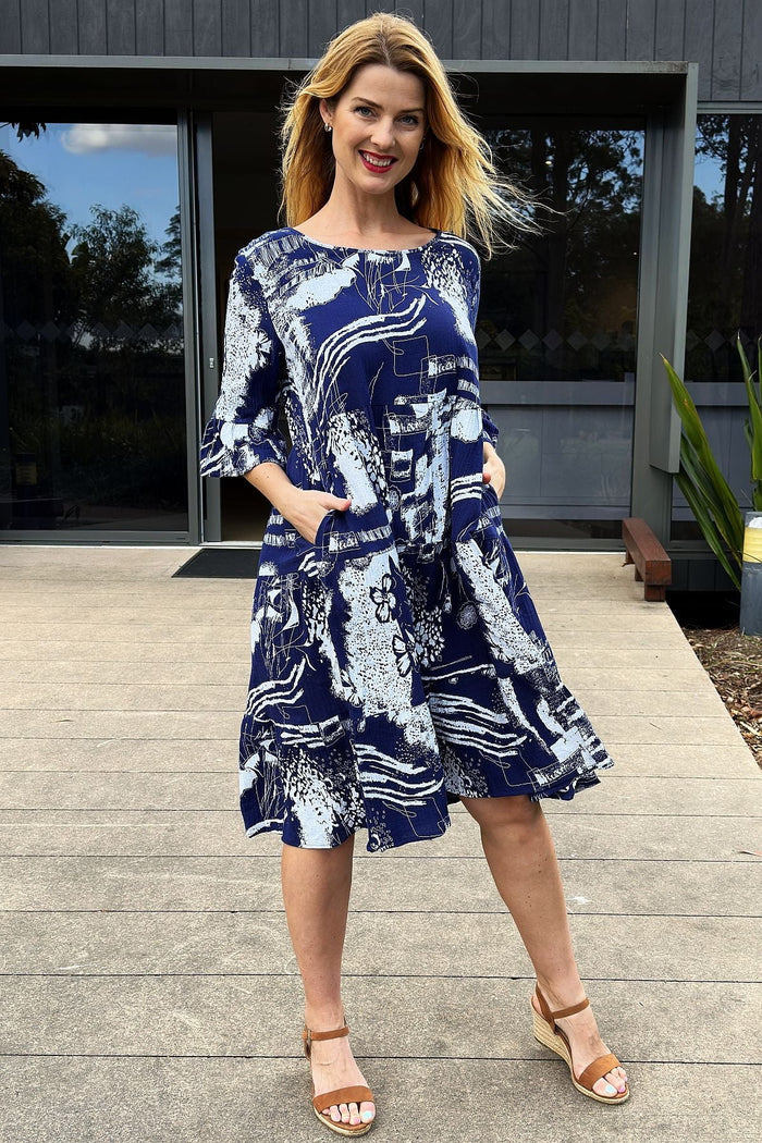 Navy and white abstract tunic dress by Hourglass featuring a flowing design and artistic pattern, perfect for casual wear.